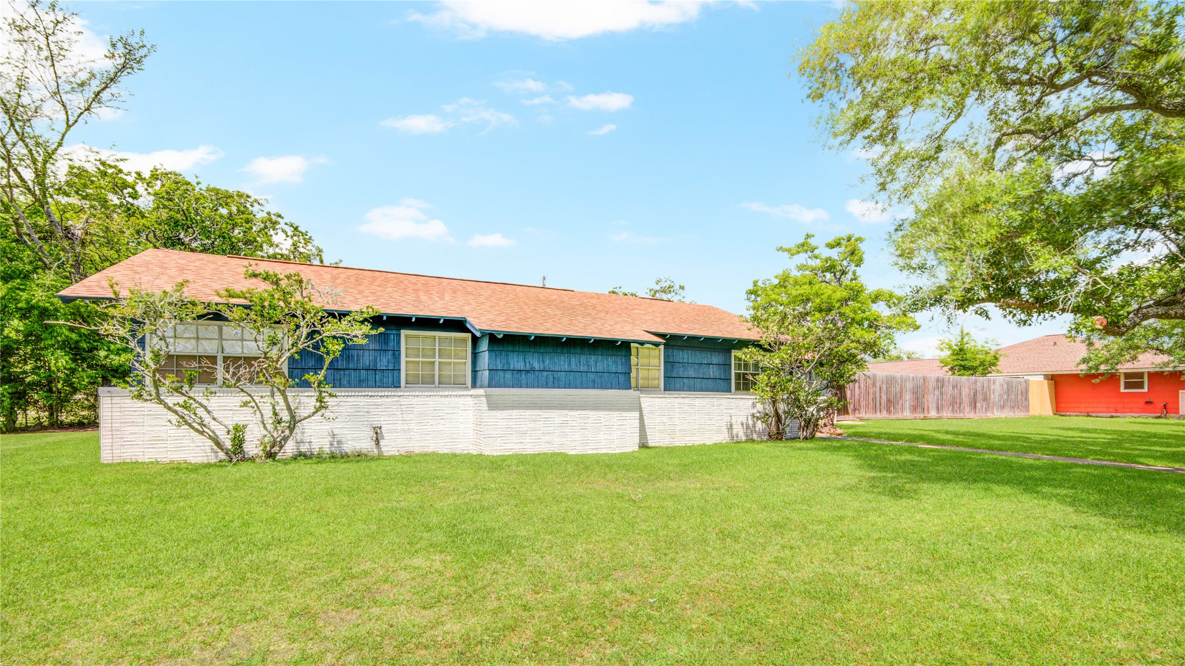1414 West 9th Street Freeport, TX 77541 - Photo 3 of 50 a view of a house with a yard and sitting area