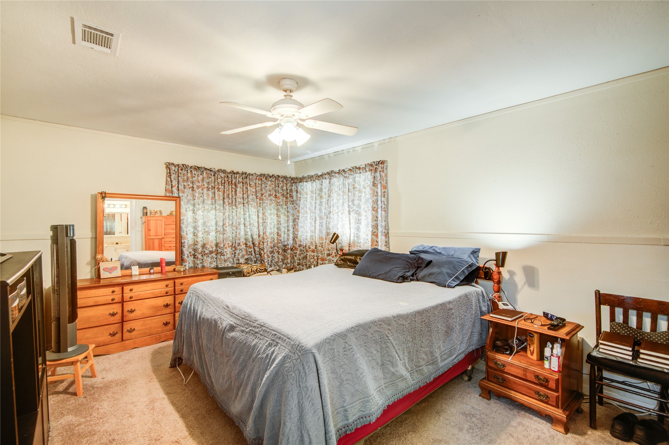 1414 West 9th Street Freeport, TX 77541 - Photo 34 of 50 a bedroom with a bed and wooden floor