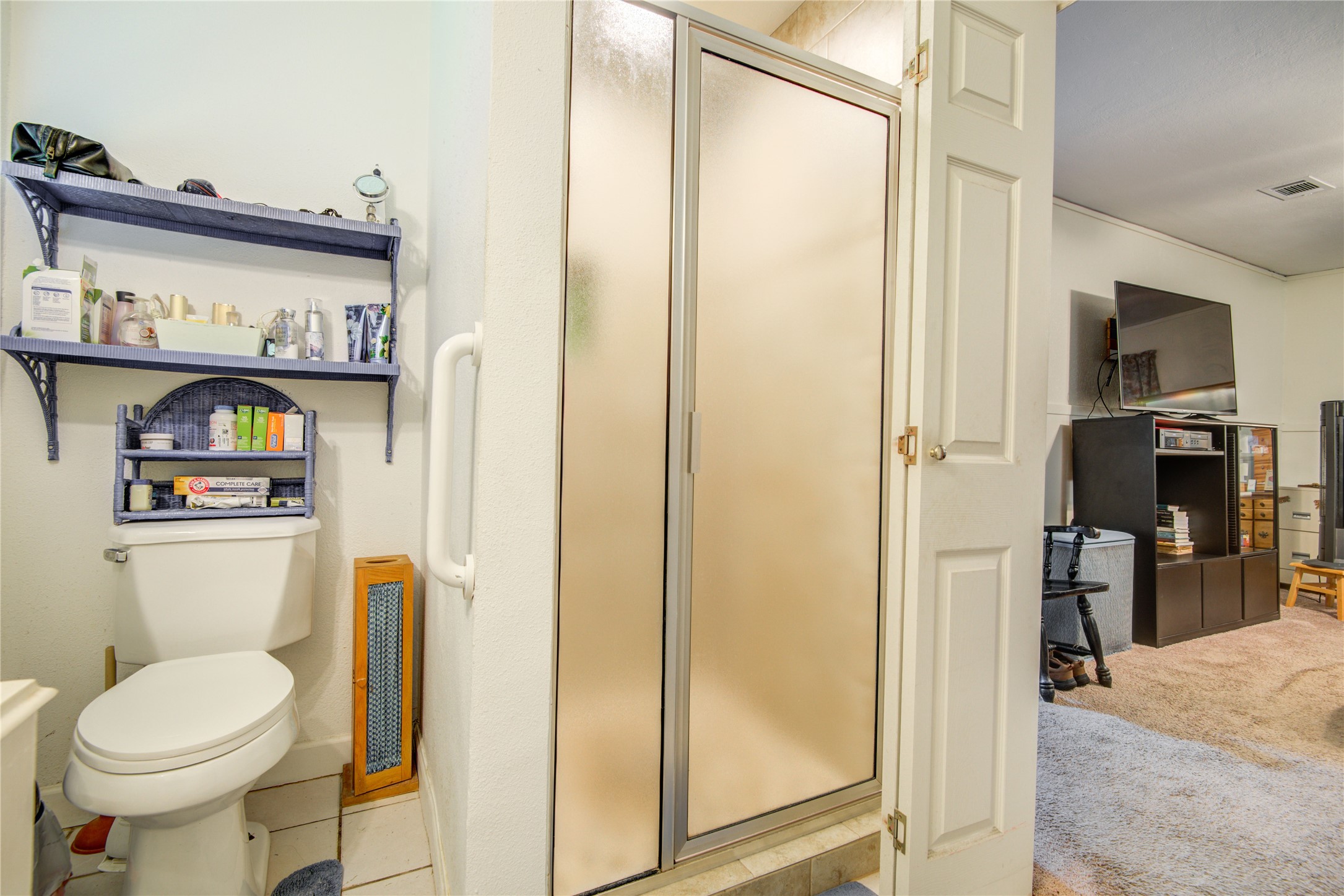 1414 West 9th Street Freeport, TX 77541 - Photo 38 of 50 a bathroom with a toilet sink and a shower