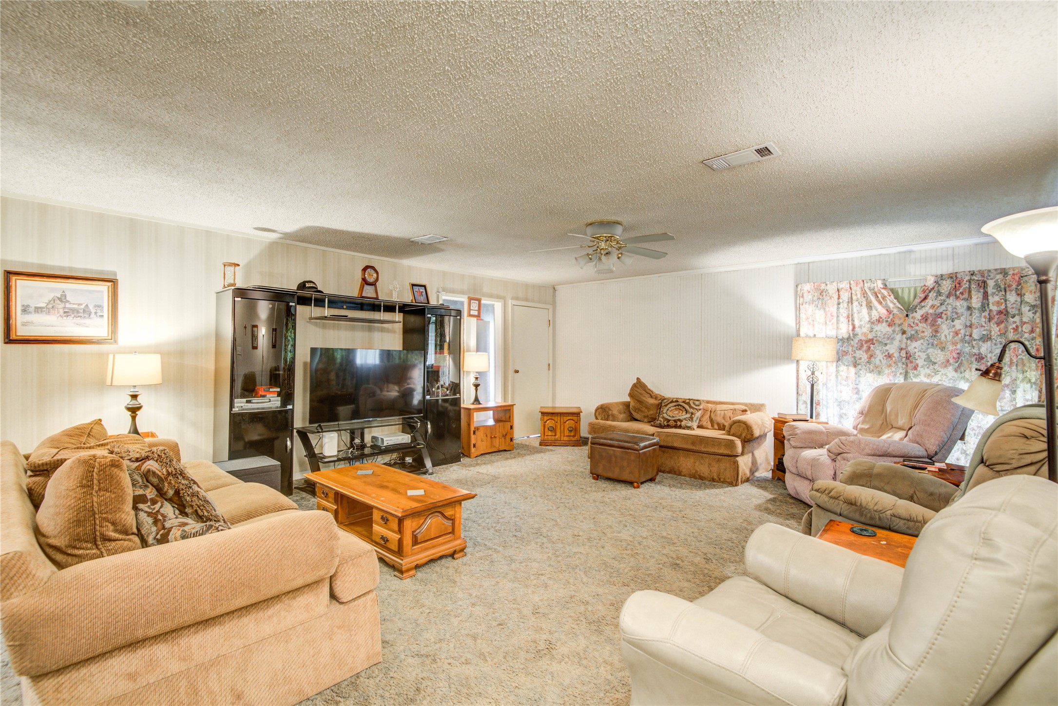 1414 West 9th Street Freeport, TX 77541 - Photo 7 of 50 a living room with furniture and a flat screen tv
