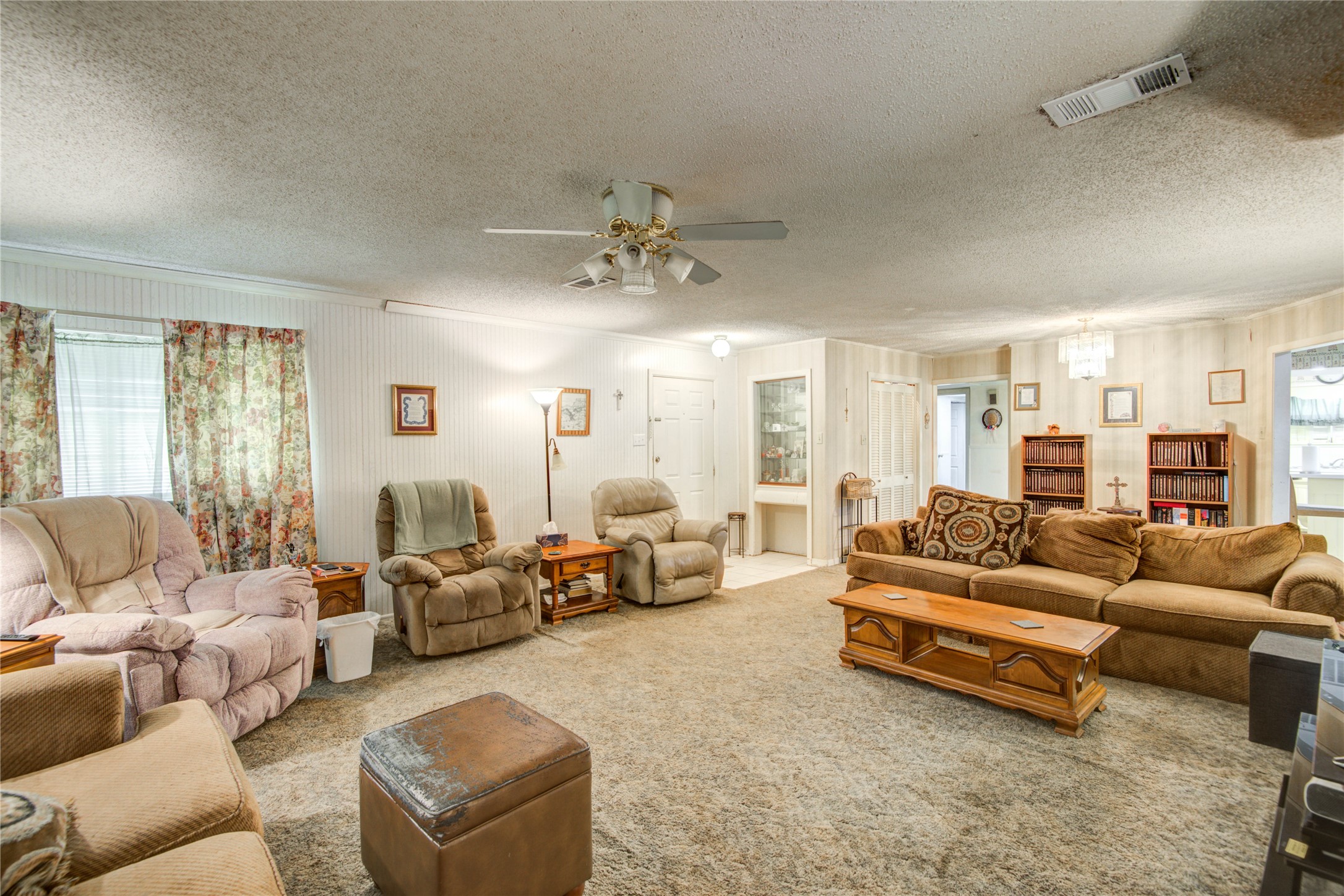 1414 West 9th Street Freeport, TX 77541 - Photo 9 of 50 a living room with furniture and a large window