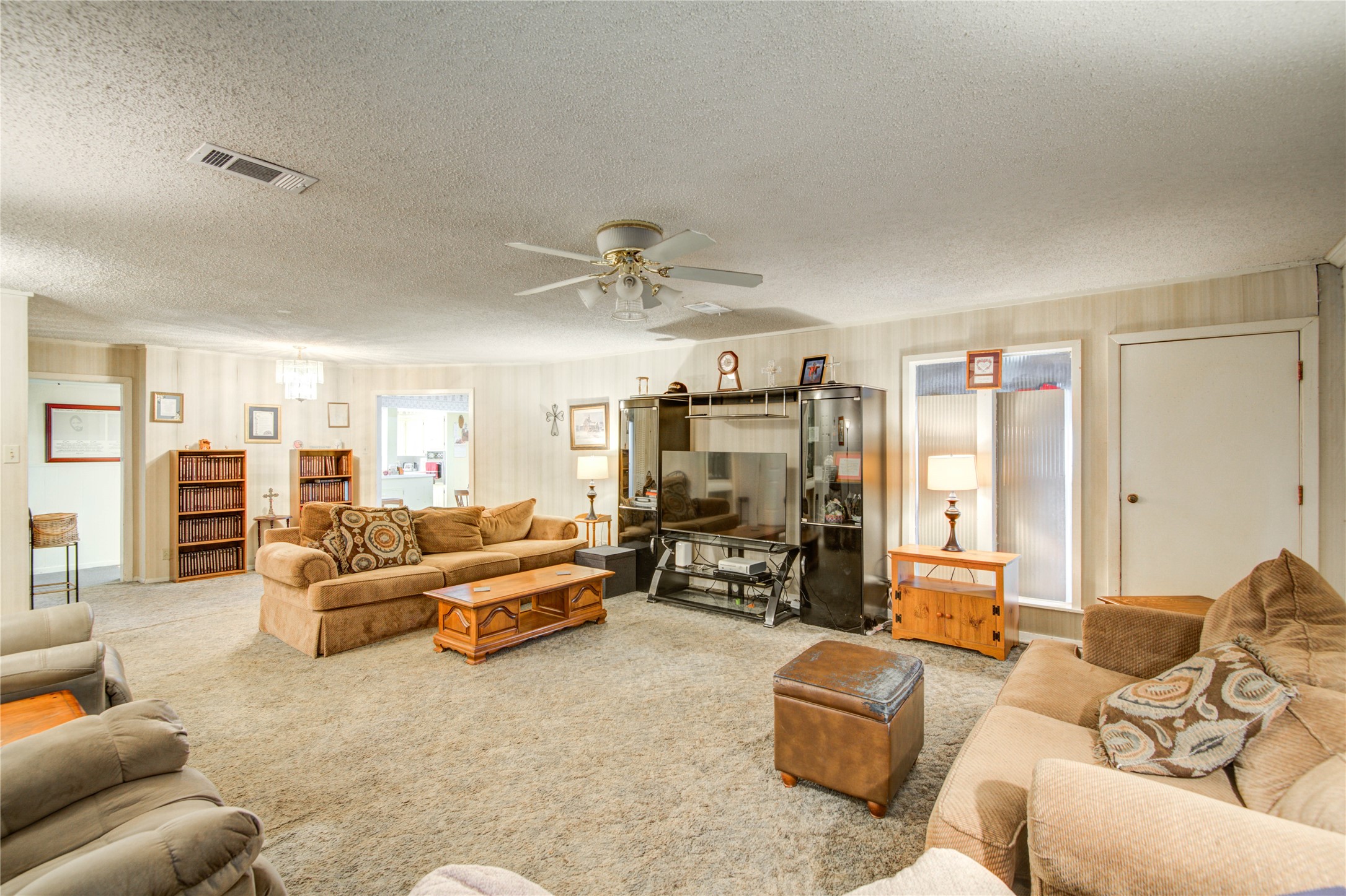1414 West 9th Street Freeport, TX 77541 - Photo 10 of 50 a living room with furniture and a flat screen tv