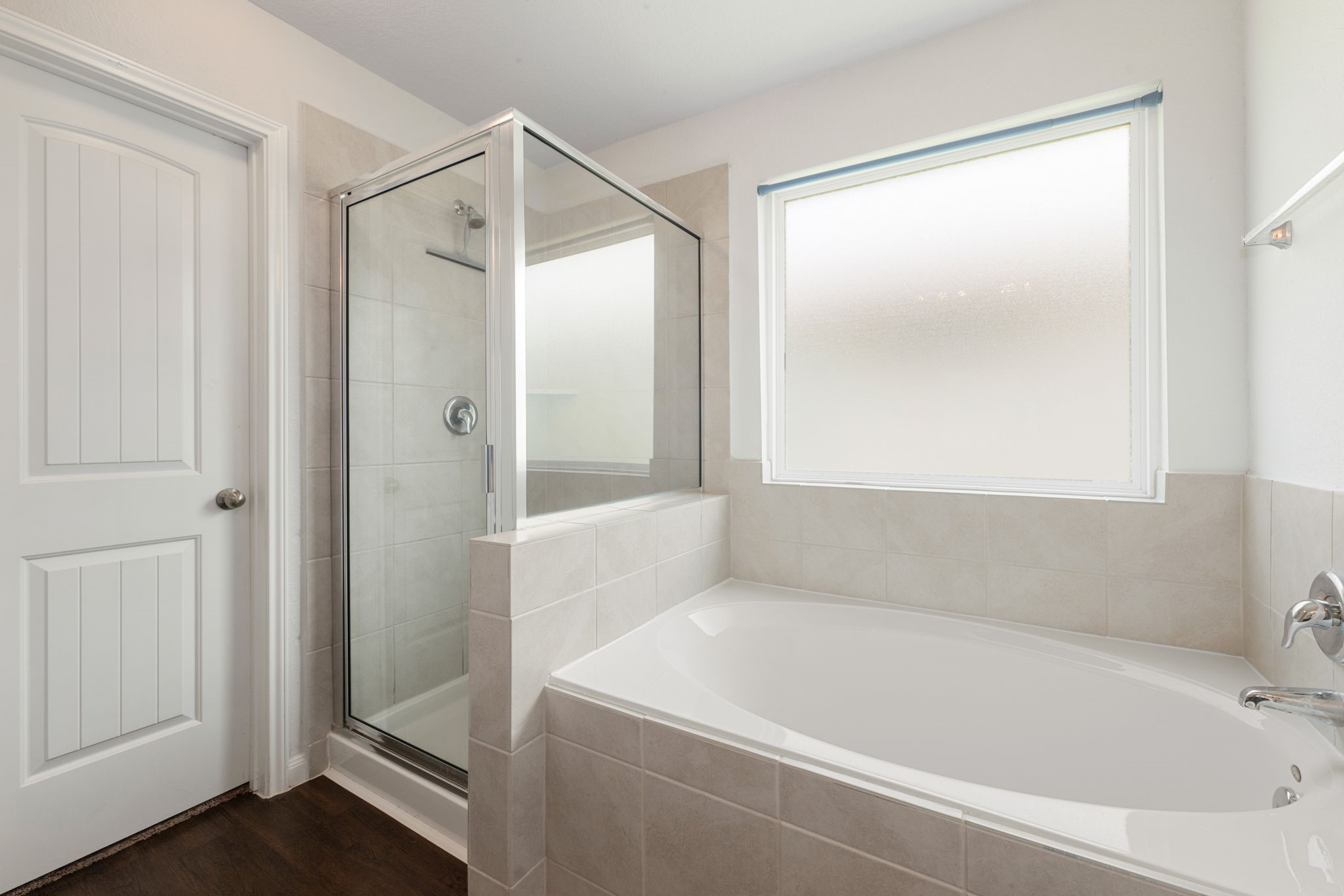 17555 Greystanes Road Humble, TX 77346 - Photo 14 of 28 a bathroom with a bathtub and a shower