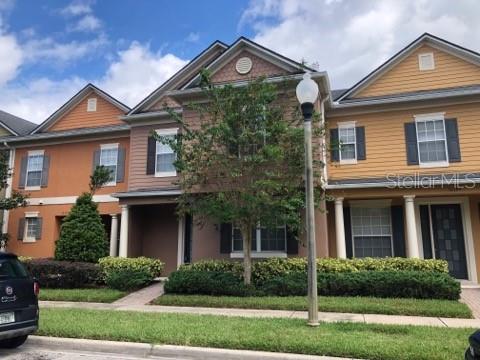 10195 Ridgebloom Avenue Orlando, FL 32829 - Photo 1 of 1 front view of a house with a yard