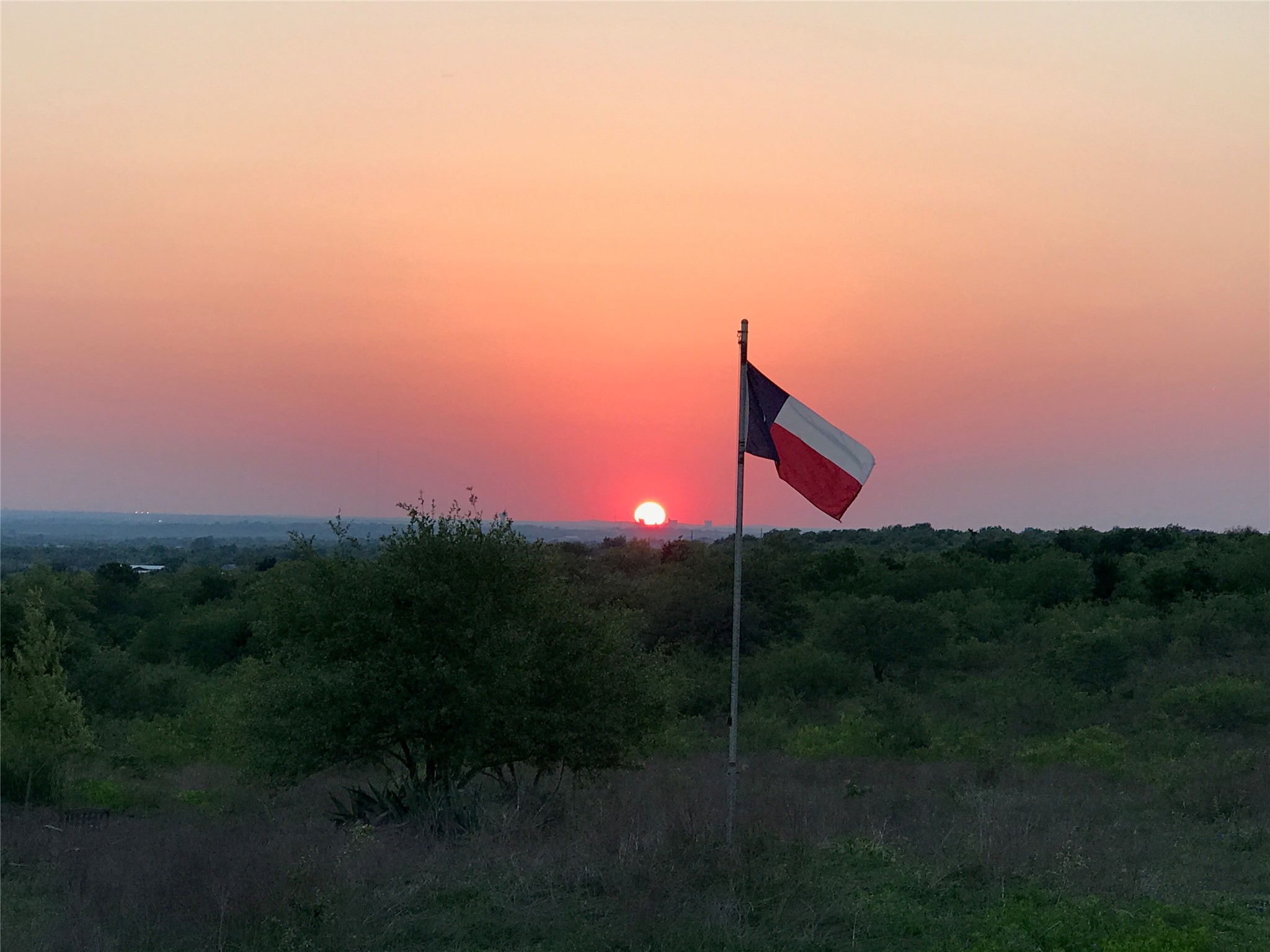 15501 Goforth Road Kyle, TX 78640 - Photo 2 of 21 a backyard of a house with lots of green space and mountain view