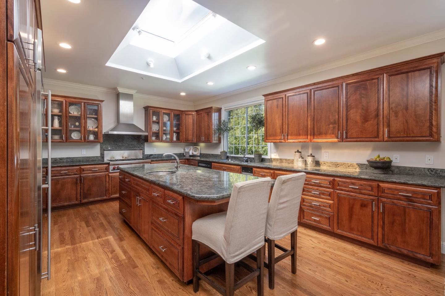 730 Chateau Drive Hillsborough, CA 94010 - Photo 18 of 48 a kitchen with stainless steel appliances granite countertop wooden cabinets a sink and dishwasher