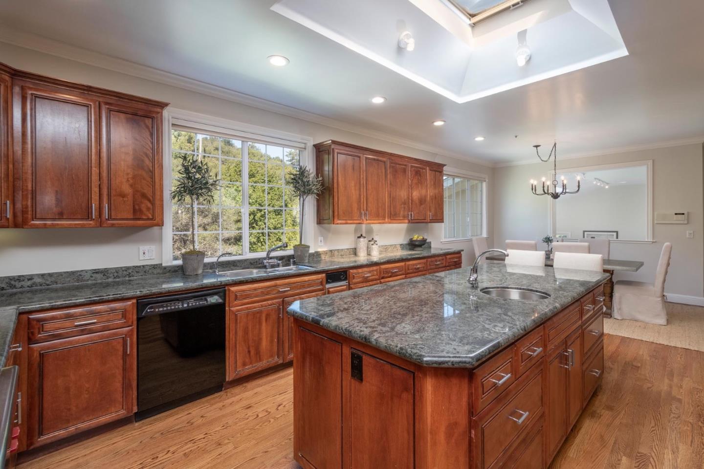 730 Chateau Drive Hillsborough, CA 94010 - Photo 20 of 48 a kitchen with granite countertop kitchen island granite countertop wooden cabinets a sink and stainless steel appliances