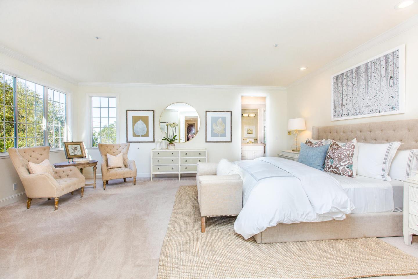 730 Chateau Drive Hillsborough, CA 94010 - Photo 21 of 48 a spacious bedroom with a bed a couch and large window