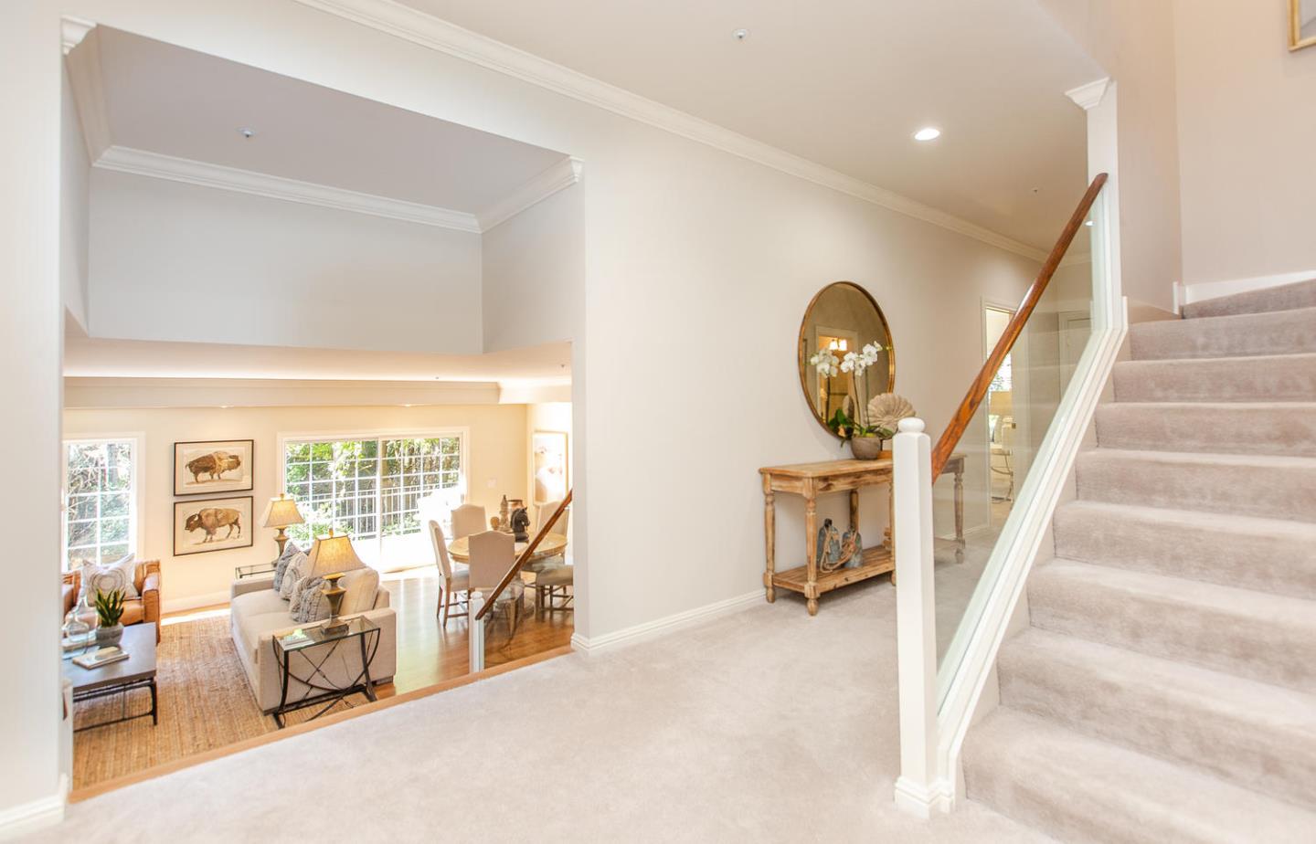 730 Chateau Drive Hillsborough, CA 94010 - Photo 25 of 48 a view of a livingroom with furniture staircase front door and windows