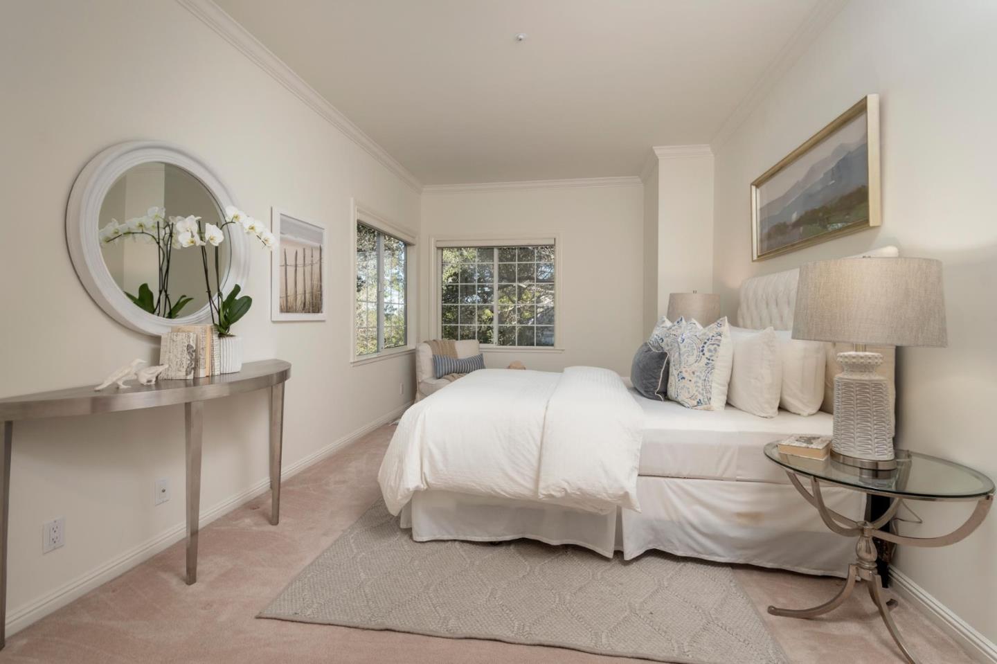 730 Chateau Drive Hillsborough, CA 94010 - Photo 34 of 48 a bedroom with a large bed and a chandelier