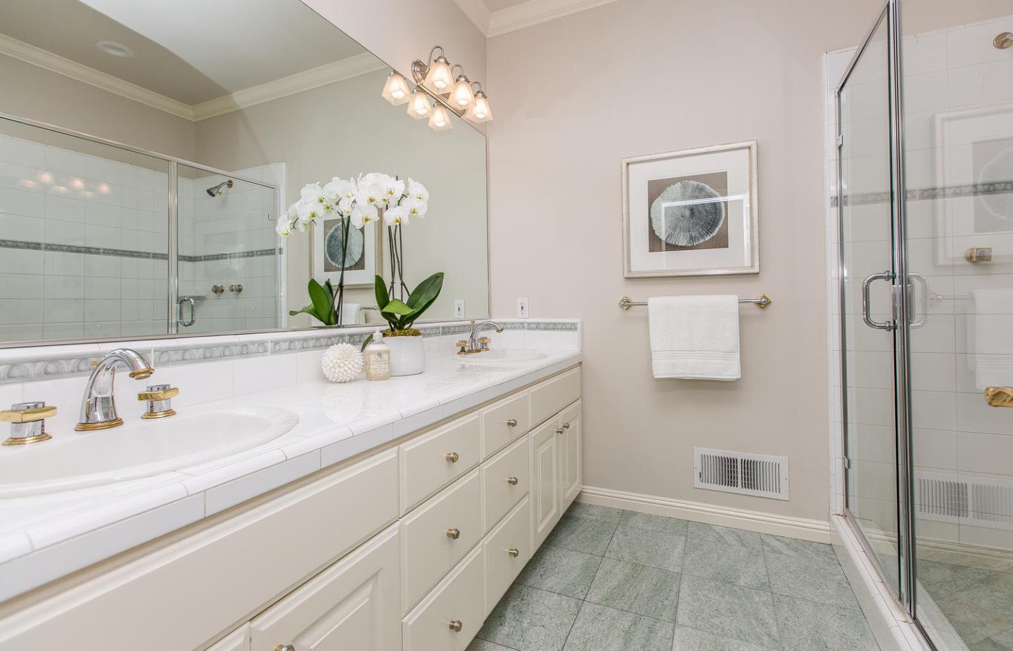 730 Chateau Drive Hillsborough, CA 94010 - Photo 35 of 48 a bathroom with a sink double vanity and a shower