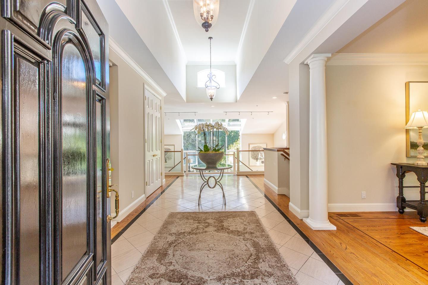 730 Chateau Drive Hillsborough, CA 94010 - Photo 4 of 48 a view of a hallway with furniture and a chandelier