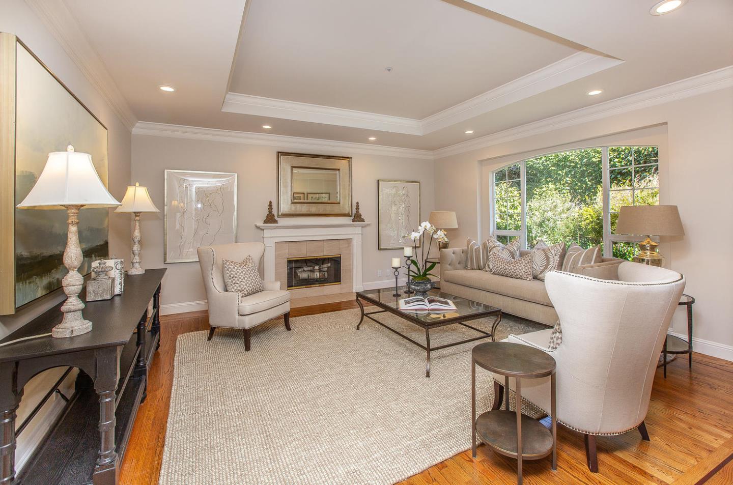 730 Chateau Drive Hillsborough, CA 94010 - Photo 6 of 48 a living room with furniture fireplace and a large window