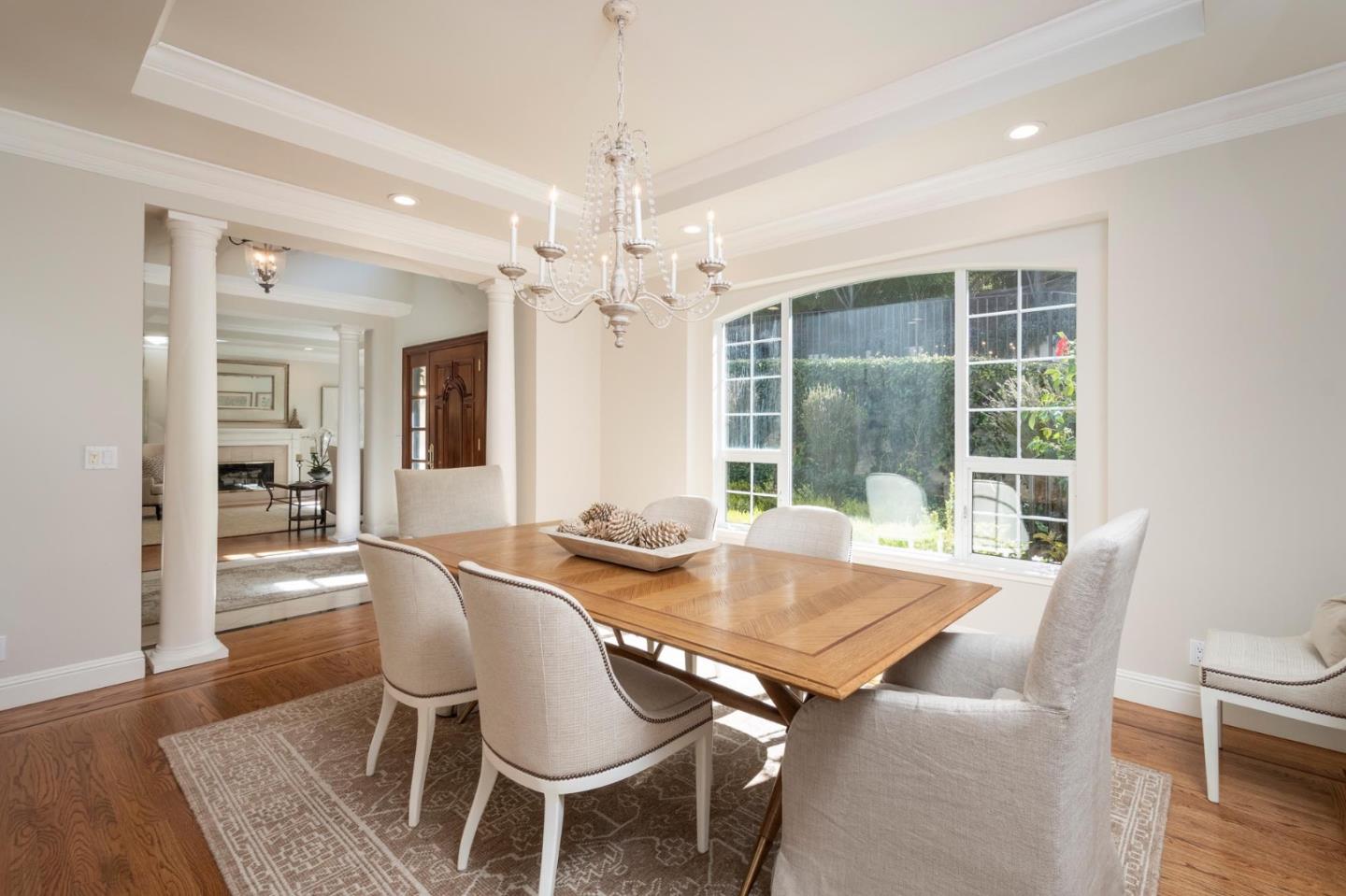 730 Chateau Drive Hillsborough, CA 94010 - Photo 8 of 48 a view of a dining room with furniture wooden floor and chandelier