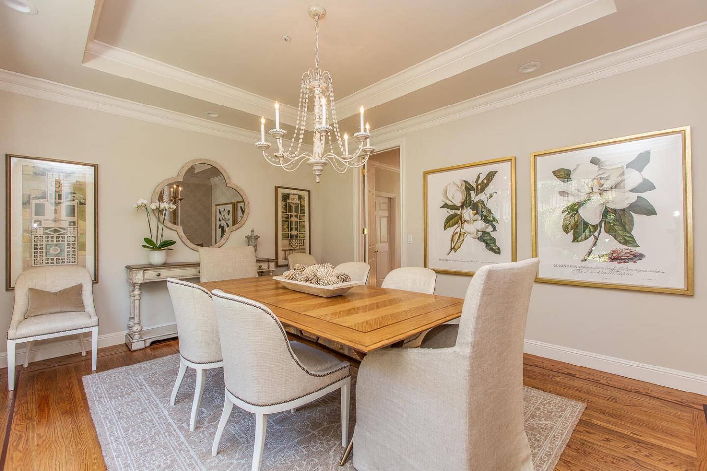 730 Chateau Drive Hillsborough, CA 94010 - Photo 9 of 48 a view of a dining room with furniture a chandelier and wooden floor