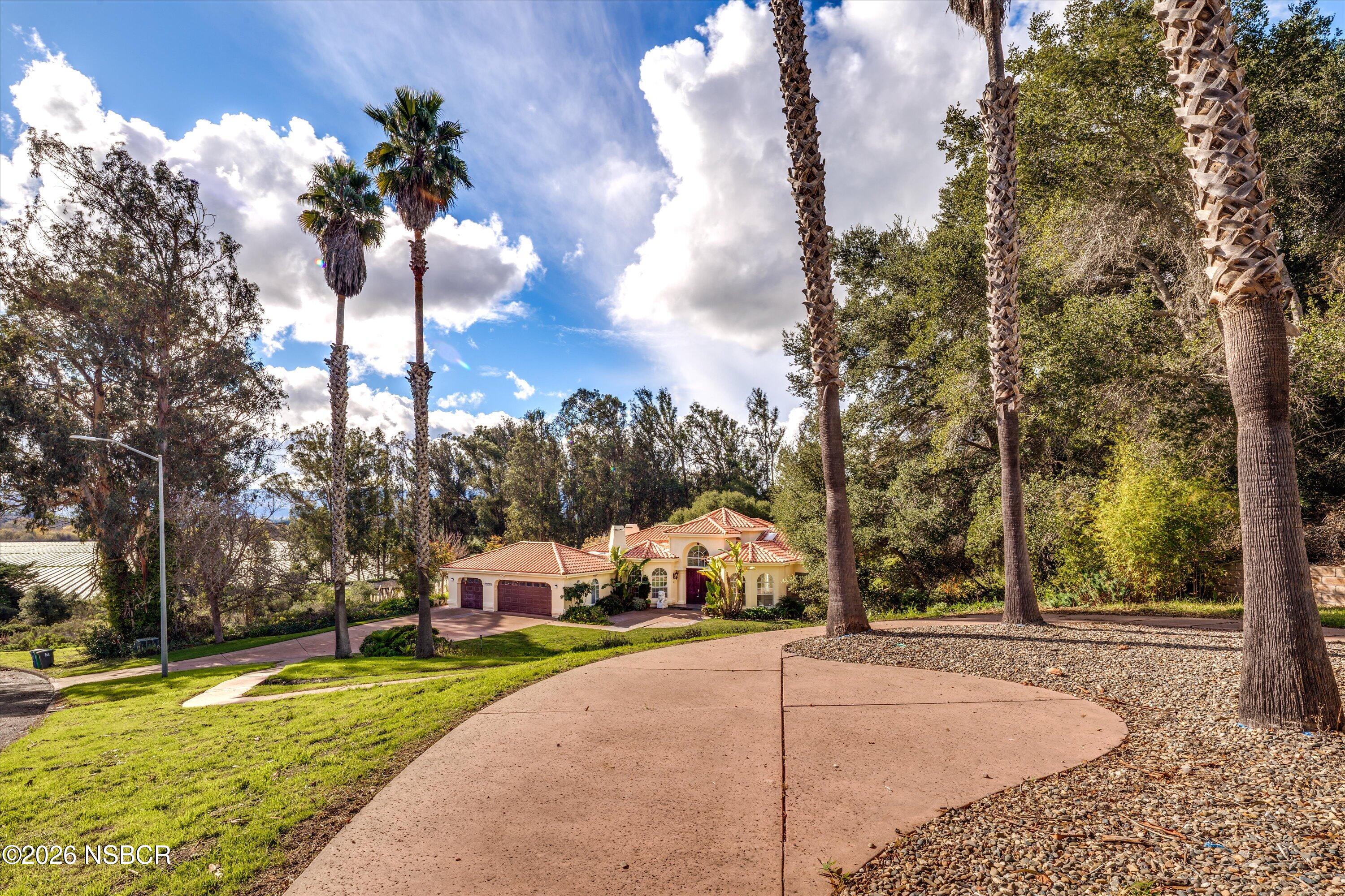 2655 Adobe Falls Road Lompoc, CA 93436 - Photo 7 of 51 a view of a house with a yard and pathway