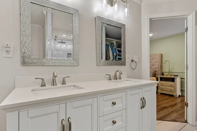 a bathroom with a shower sink and mirror