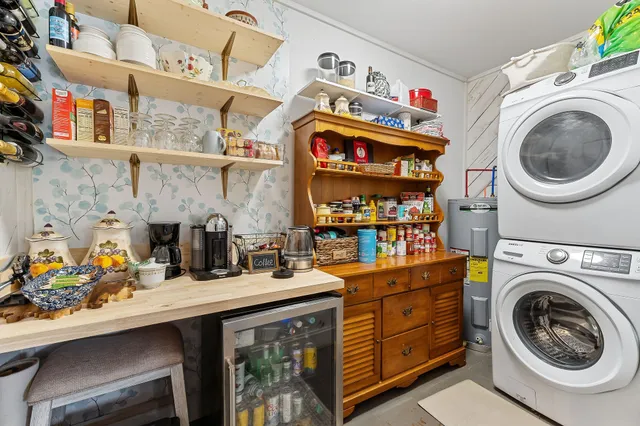 a livingroom with workspace and a window