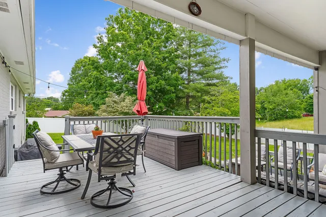 a outdoor space with patio couch and a potted plant