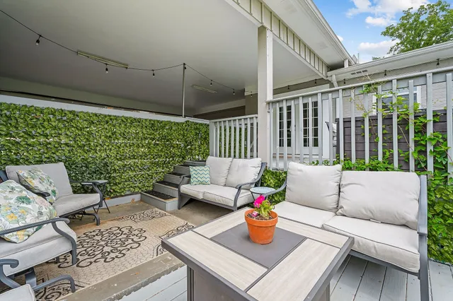 a backyard of a house with a garden and plants