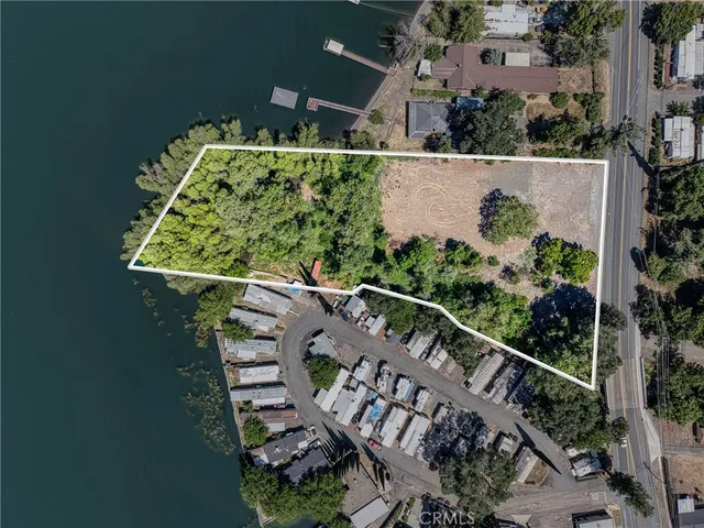 an aerial view of a house with outdoor space