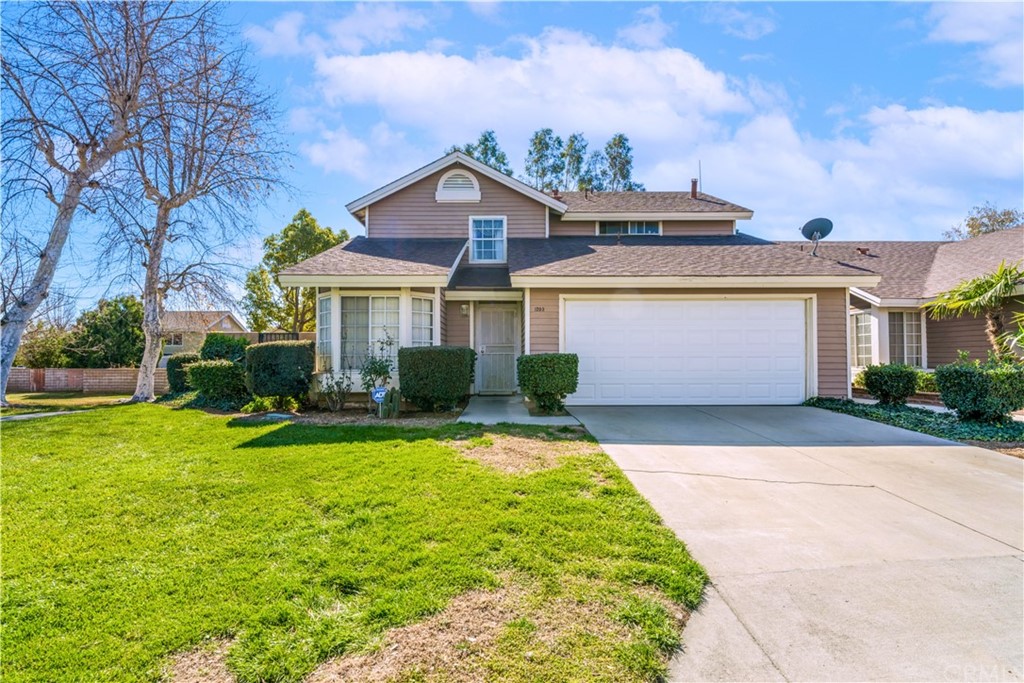1203 West Victoria Street Rialto, CA 92376 - Photo 1 of 1 a front view of a house with garden