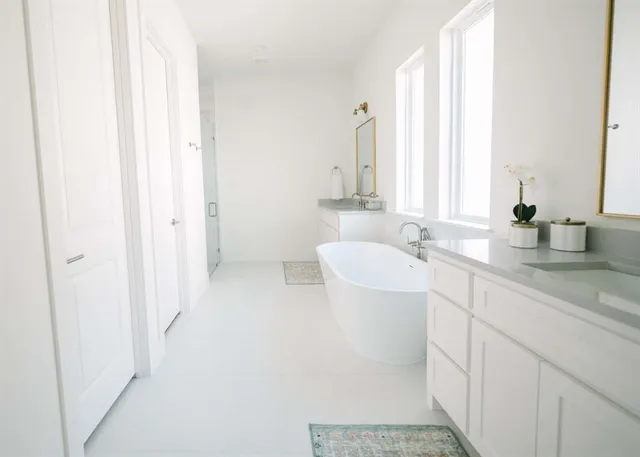 a bathroom with a sink a mirror and a bathtub