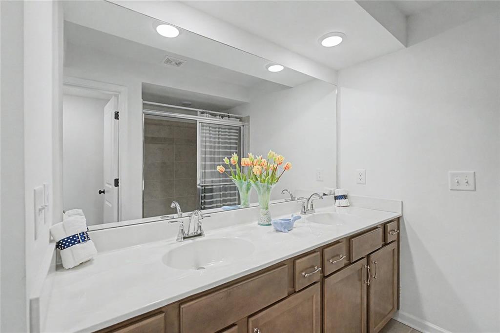 2310 Portrush Way Southeast Atlanta, GA 30339 - Photo 31 of 38 a bathroom with a sink and a mirror