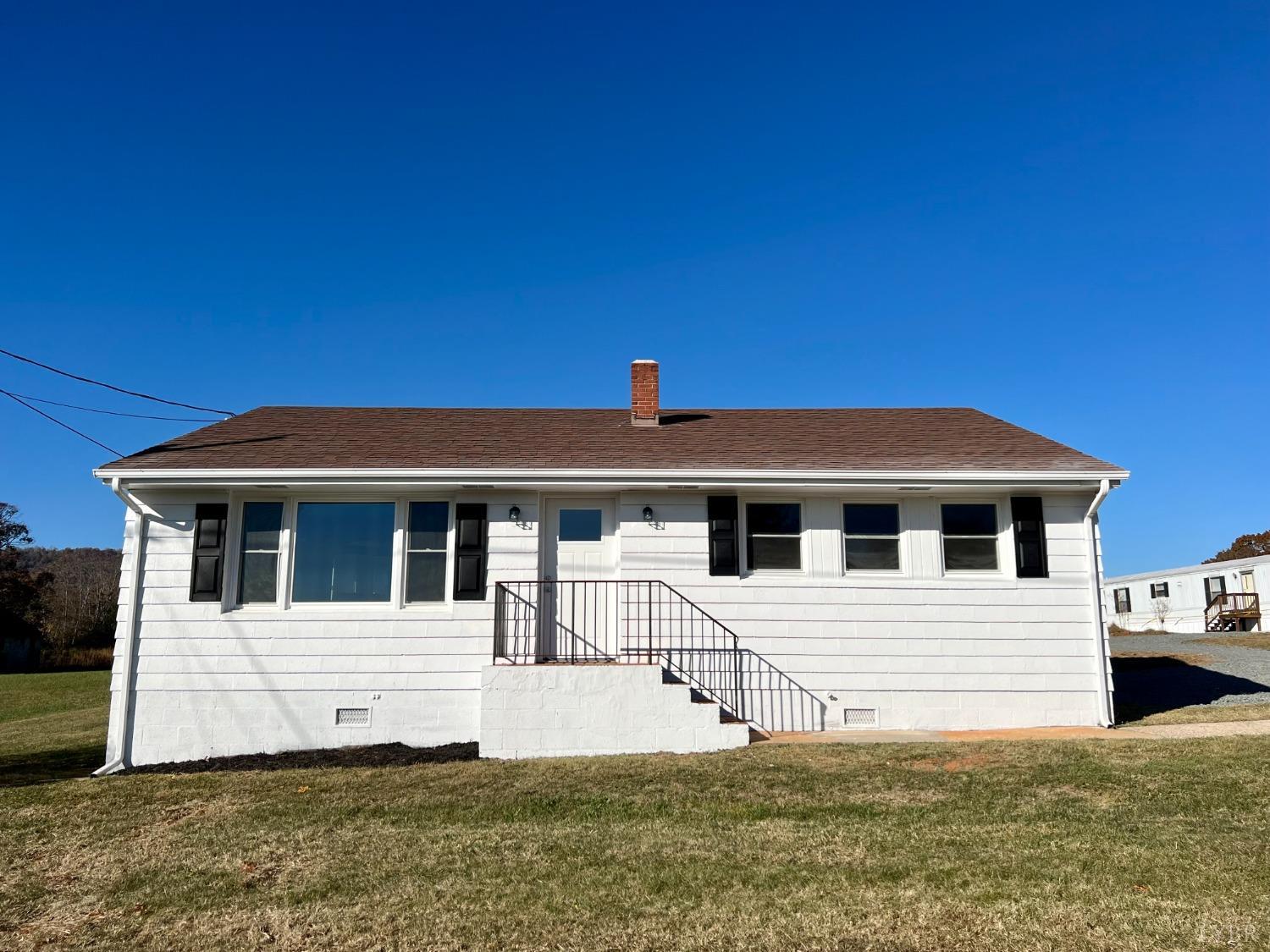 2178 Cedar Gate Road Madison Heights, VA 24572 - Photo 1 of 31 a front view of a house with a garden