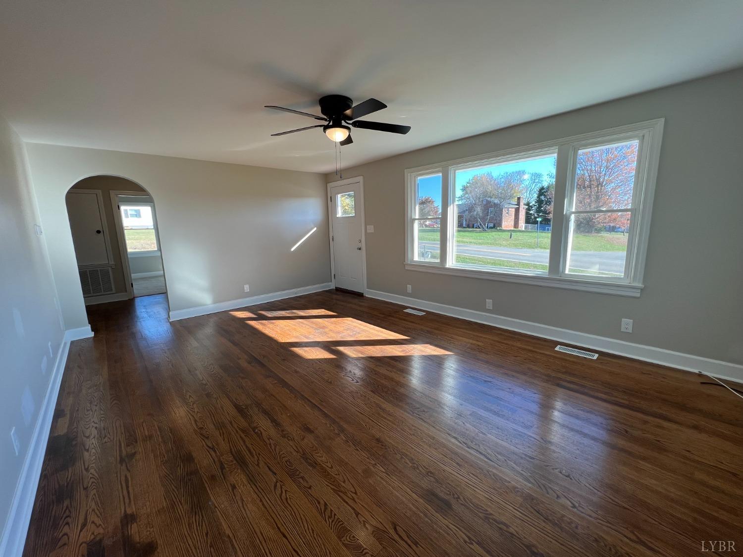 2178 Cedar Gate Road Madison Heights, VA 24572 - Photo 12 of 31 a view of empty room with wooden floor and fan