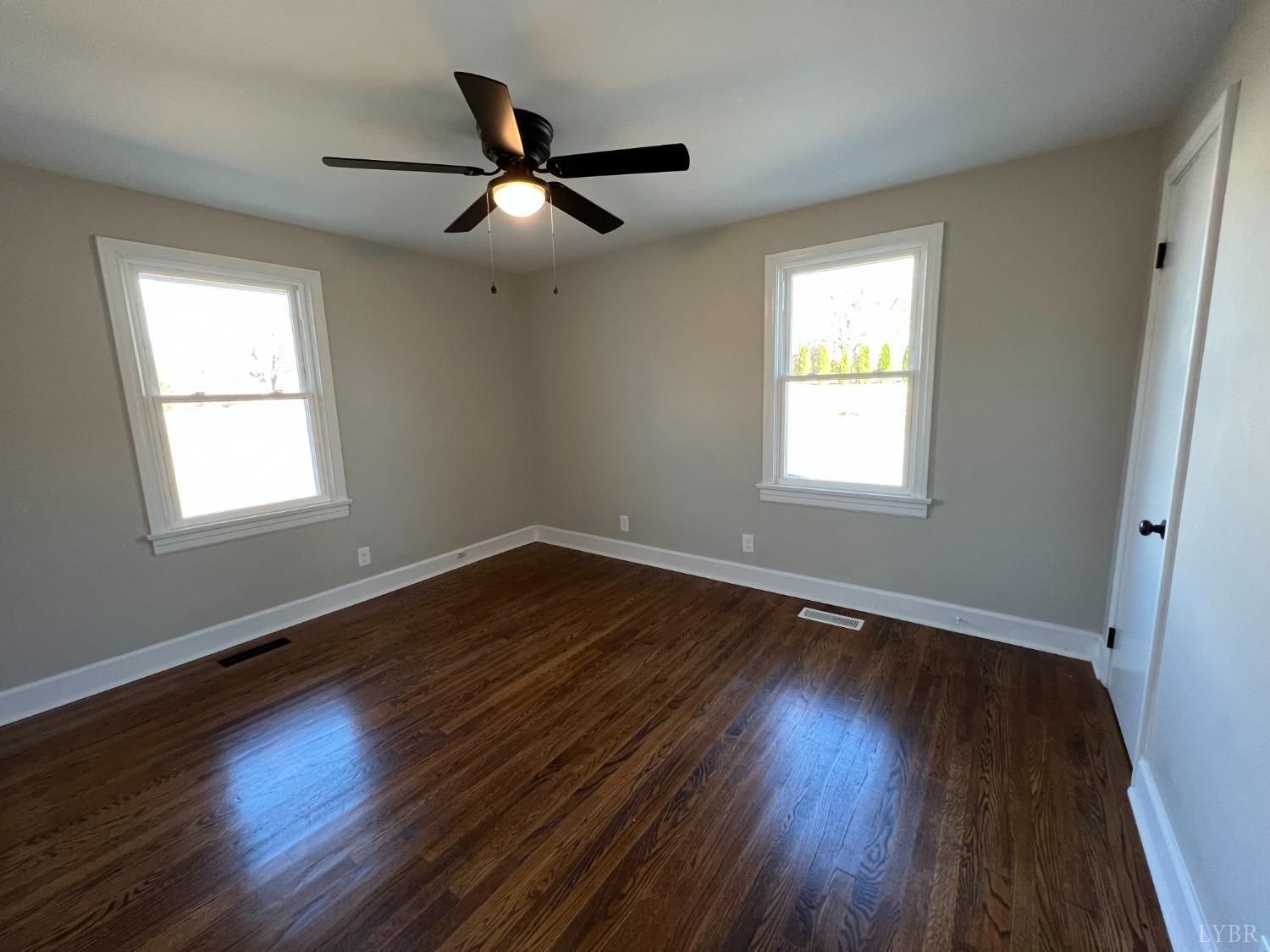 2178 Cedar Gate Road Madison Heights, VA 24572 - Photo 25 of 31 a view of an empty room with wooden floor and a window