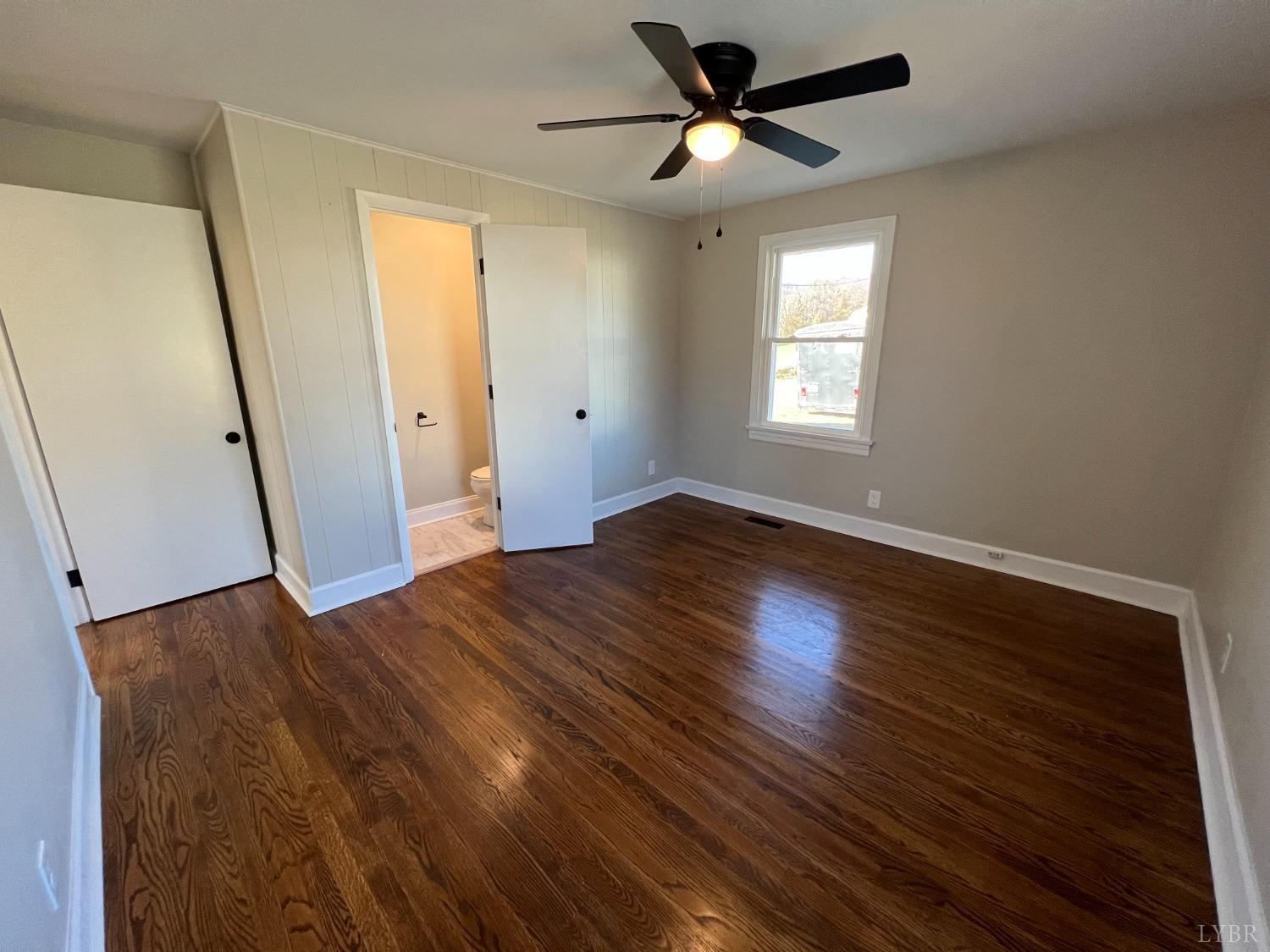2178 Cedar Gate Road Madison Heights, VA 24572 - Photo 26 of 31 a view of empty room with wooden floor and fan
