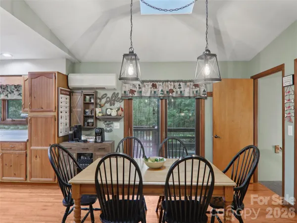 a kitchen with stainless steel appliances granite countertop a refrigerator a sink a stove and oven