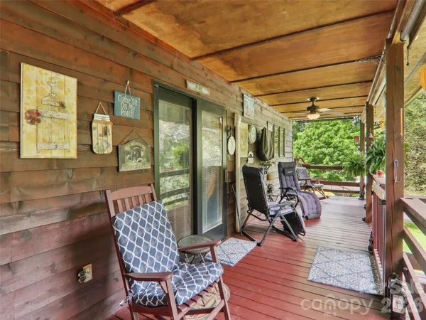 a view of a patio with dining table and chairs