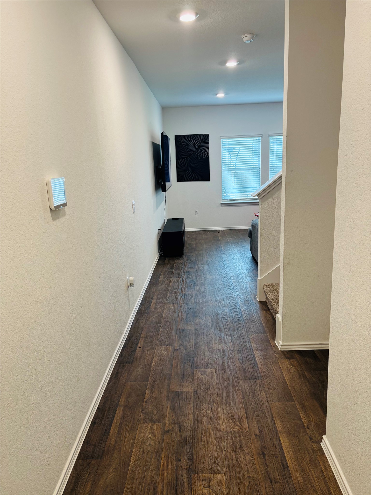14817 Perlino Way, Unit A Manor, TX 78653 - Photo 2 of 40 a view of a hall with wooden floor
