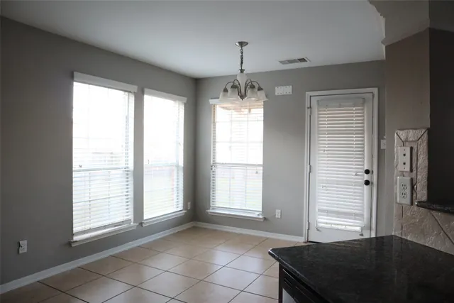 a view of a windows and an entryway in a room