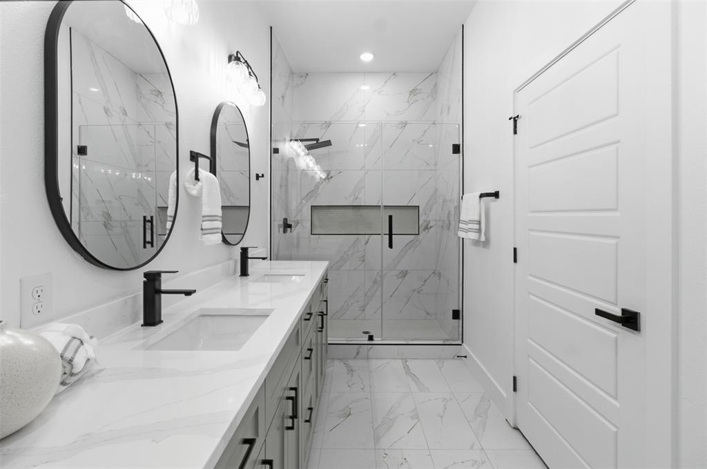 429 Waterboard Road Trinidad, TX 75163 - Photo 17 of 25 Double vanity with integrated sinks, quartz countertop, and matte black fixtures