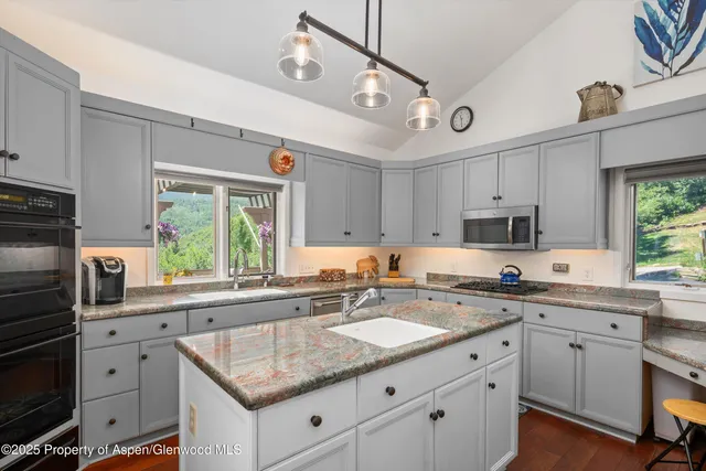 a bathroom with a sink double vanity and a mirror