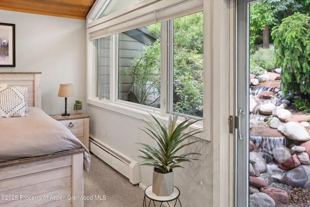 a table with a vase and flowers on it