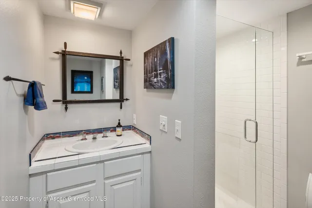 a kitchen with stainless steel appliances granite countertop a sink and a stove