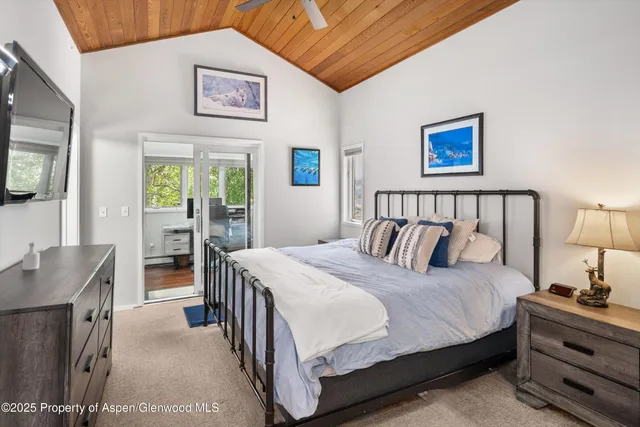 a view of a lush green hillside and houses