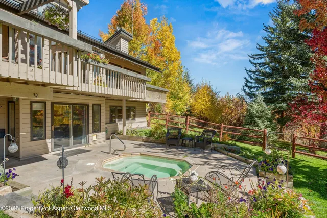 a view of a chairs and table in the patio
