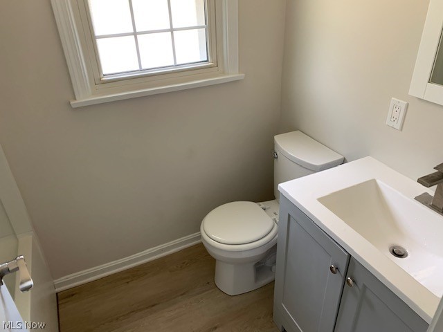 38522 Rogers Road Willoughby, OH 44094 - Photo 7 of 9 Bathroom featuring wood-type flooring, vanity, and toilet