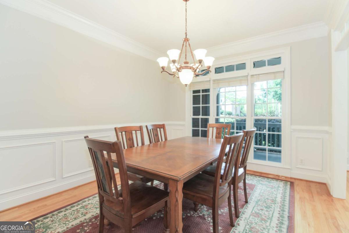 1031 Spring Lake Drive Bishop, GA 30621 - Photo 13 of 18 a view of a dining room with furniture window and wooden floor