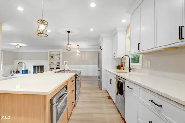a kitchen with a stove and a refrigerator