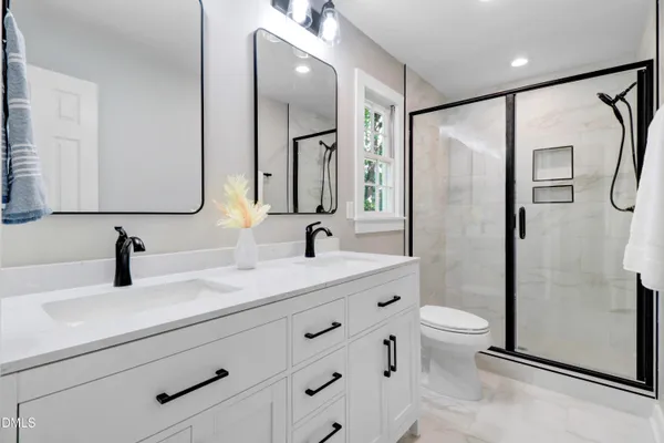 a view of a city with lush green forest