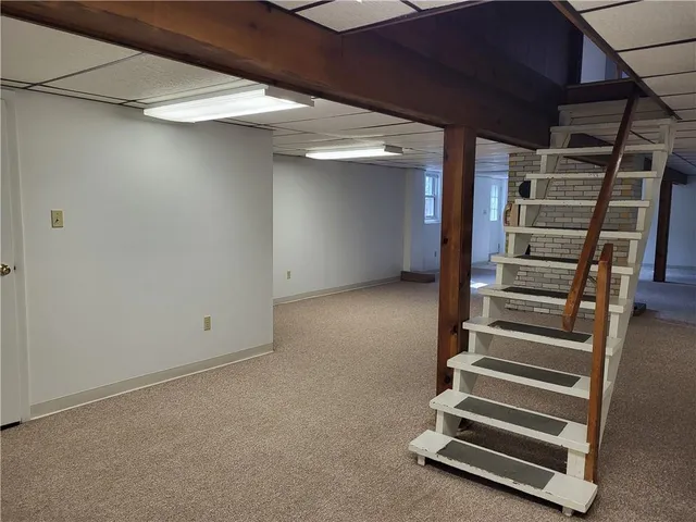 a view of an empty room with stairs