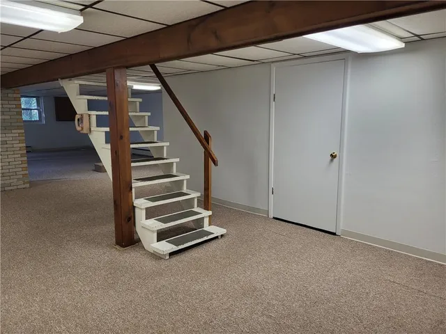 a view of an empty room with stairs