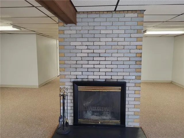 an empty room with a fireplace