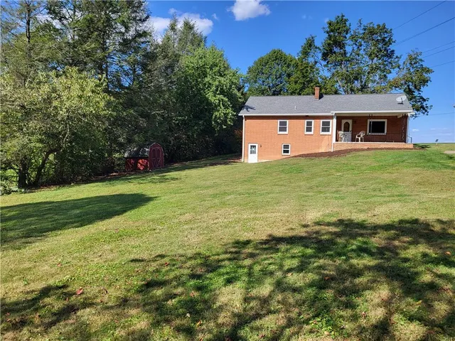 a view of a yard with a tree